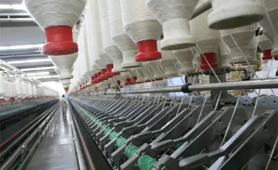 Roving bobbins on the mill floor